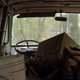 Many vans were once used as dry storage for parts taken off other cars. One van was filled to the roof with old oil cans, another chock full of old radios. Signs nailed to trees helpfully point to these mini attractions.
